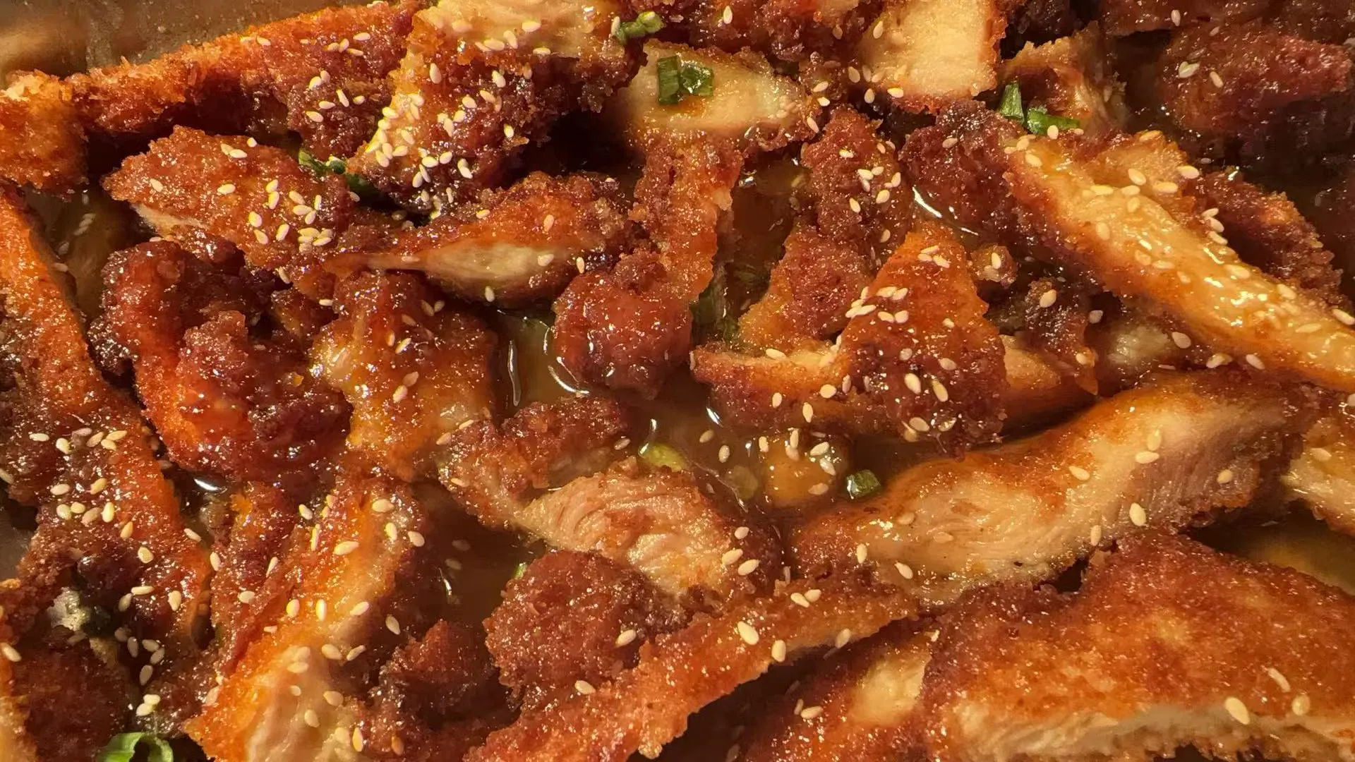 Honey glazed fried chicken strips topped with toasted white sesame seeds at Sakura Buffet Restaurant in Pittsfield