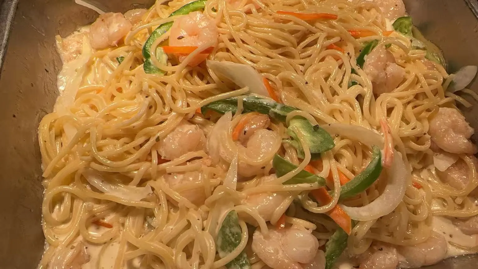 Creamy shrimp spaghetti stir fry with bell peppers, onions and carrot strips at Sakura Buffet Restaurant in Pittsfield